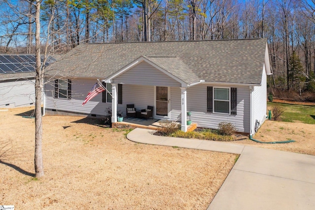 ranch-style house featuring crawl space, a porch, a front yard, and a shingled roof