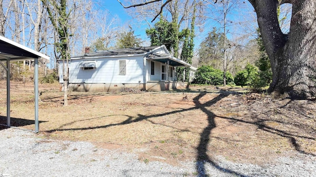 view of side of property featuring crawl space