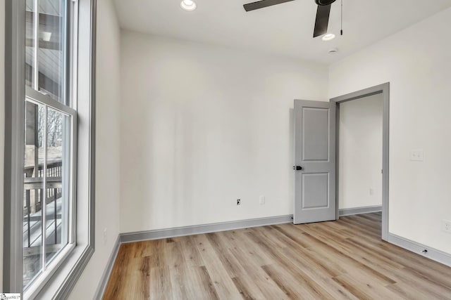 unfurnished room with recessed lighting, baseboards, a ceiling fan, and light wood finished floors