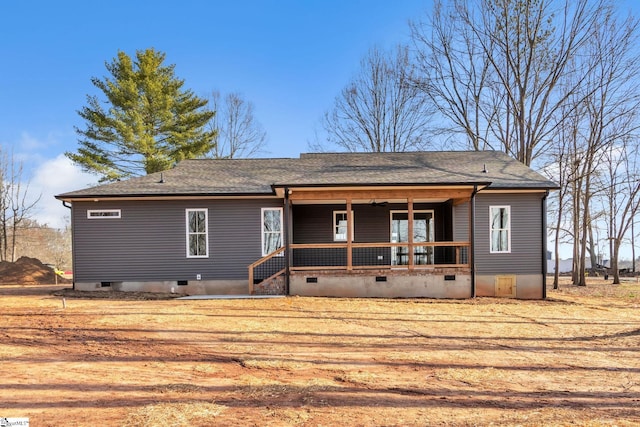 back of house featuring crawl space, a porch, and a shingled roof