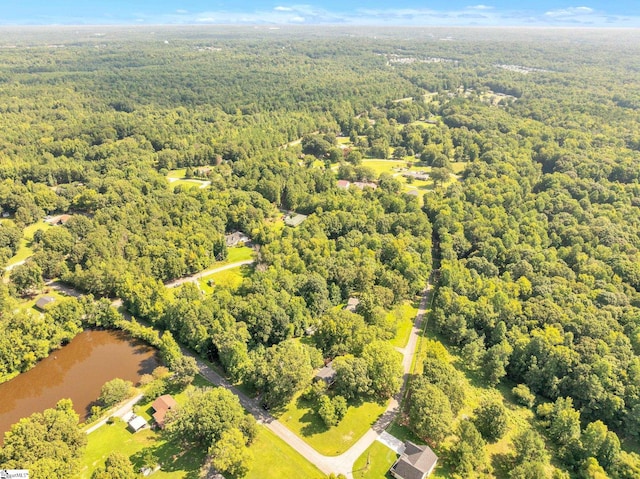 birds eye view of property with a wooded view