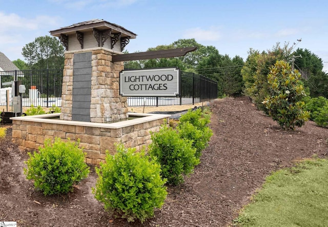 community sign with fence