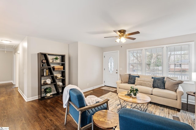 living room featuring a wealth of natural light, wood finished floors, attic access, and ceiling fan