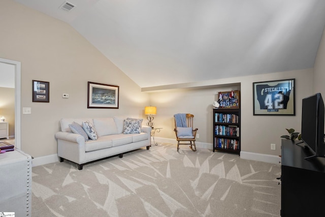 carpeted living area featuring visible vents, baseboards, and vaulted ceiling