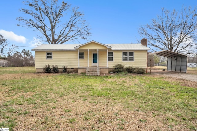 ranch-style house with driveway, covered porch, a carport, a front lawn, and metal roof