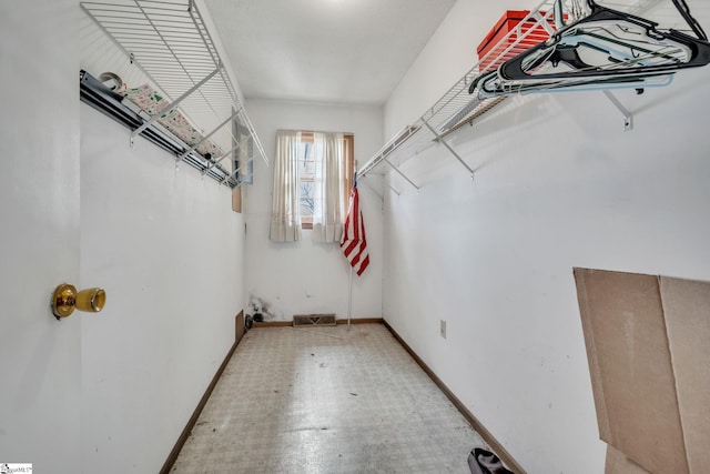 spacious closet featuring visible vents