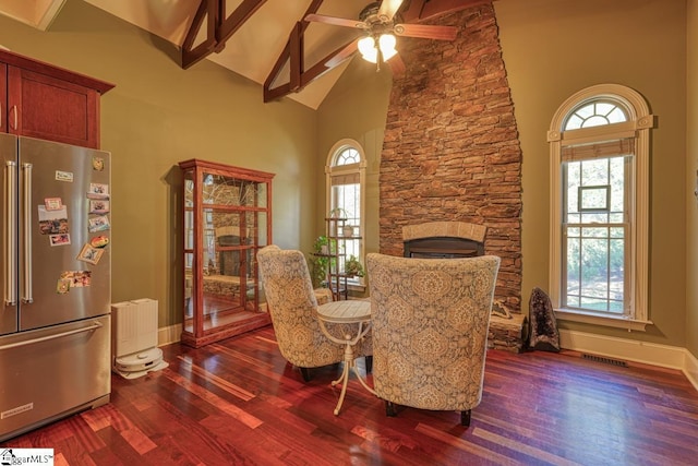 dining space with visible vents, high vaulted ceiling, a ceiling fan, dark wood-style floors, and radiator heating unit