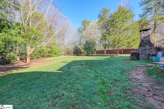 view of yard with fence