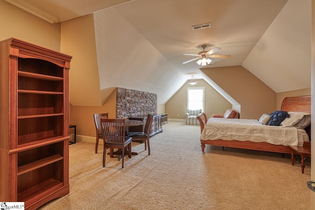 bedroom with vaulted ceiling, carpet flooring, baseboards, and visible vents