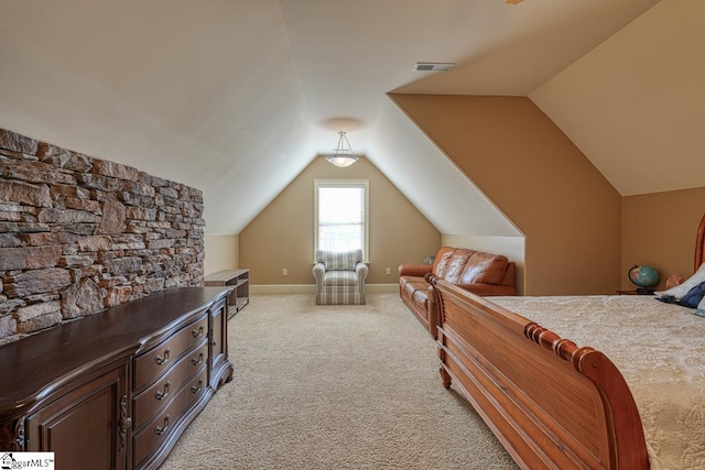 bedroom with baseboards, visible vents, light carpet, and lofted ceiling