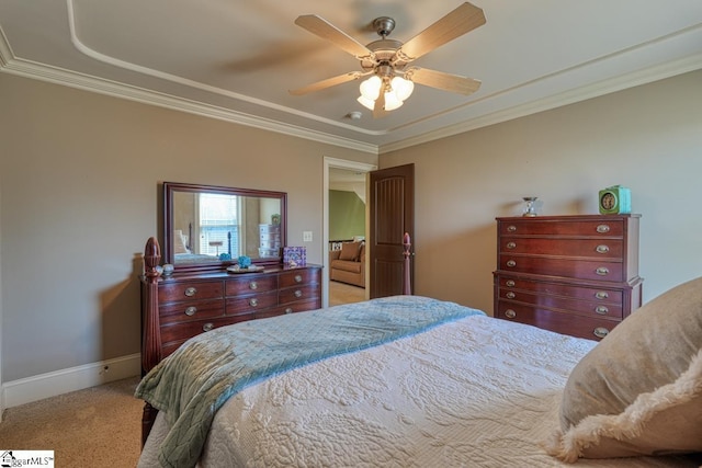 carpeted bedroom with a ceiling fan, baseboards, and ornamental molding