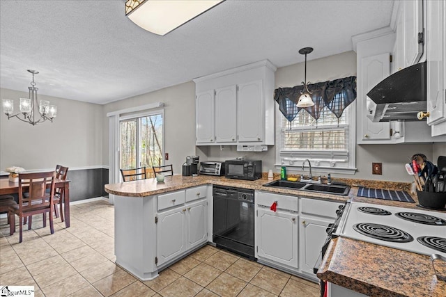 kitchen with extractor fan, a peninsula, a notable chandelier, black appliances, and a sink