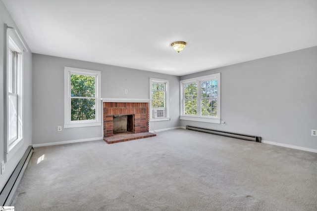 unfurnished living room featuring baseboards, baseboard heating, a brick fireplace, and carpet