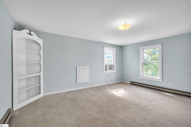 empty room featuring carpet flooring, cooling unit, a baseboard heating unit, and baseboards