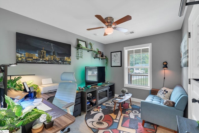 living area featuring a ceiling fan, visible vents, and baseboards