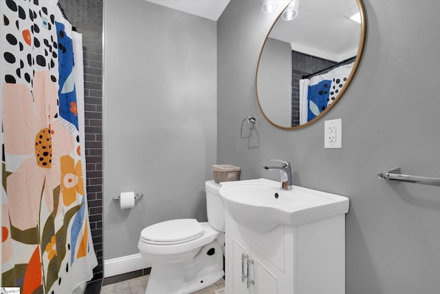 full bathroom with curtained shower, baseboards, toilet, tile patterned floors, and vanity