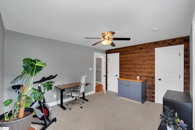 home office with light carpet, baseboards, and ceiling fan