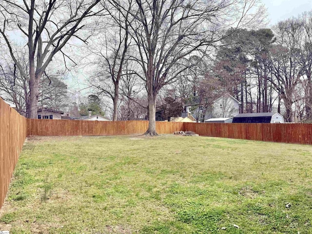 view of yard with a fenced backyard