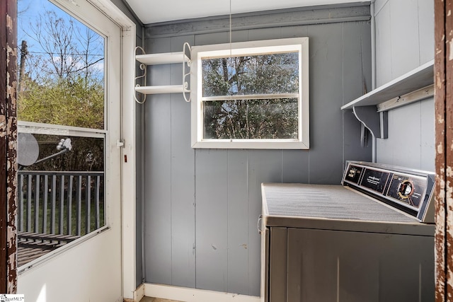 washroom featuring laundry area and washer / dryer