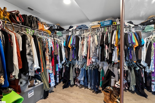 spacious closet with visible vents and wood finished floors