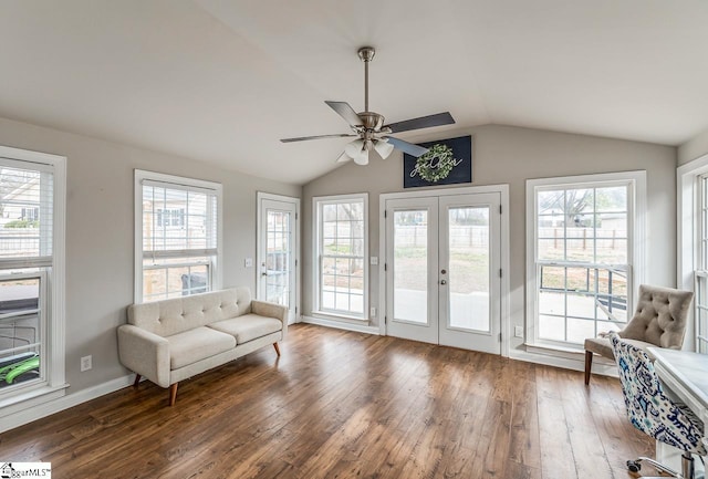 living area featuring baseboards, ceiling fan, vaulted ceiling, french doors, and wood-type flooring