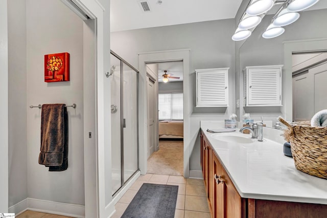 ensuite bathroom with tile patterned floors, visible vents, a shower stall, and vanity