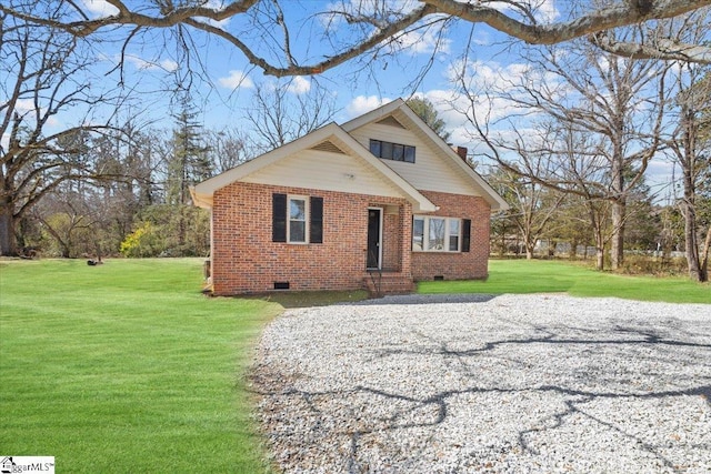 view of front of property featuring a front yard, a chimney, brick siding, and crawl space