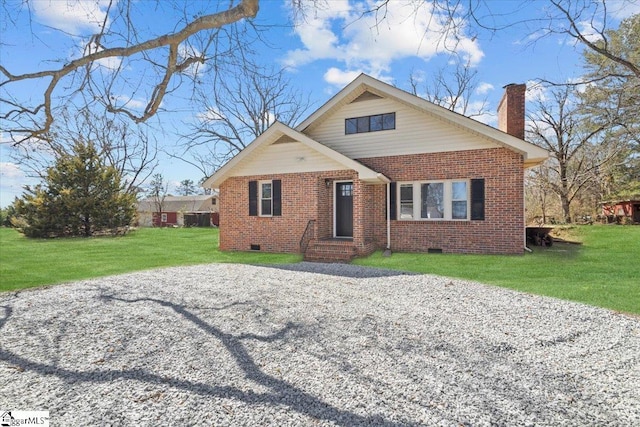 view of front of property featuring a front yard, brick siding, and crawl space