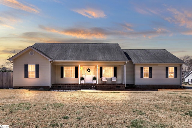 view of front of property featuring crawl space, covered porch, a front yard, and roof with shingles