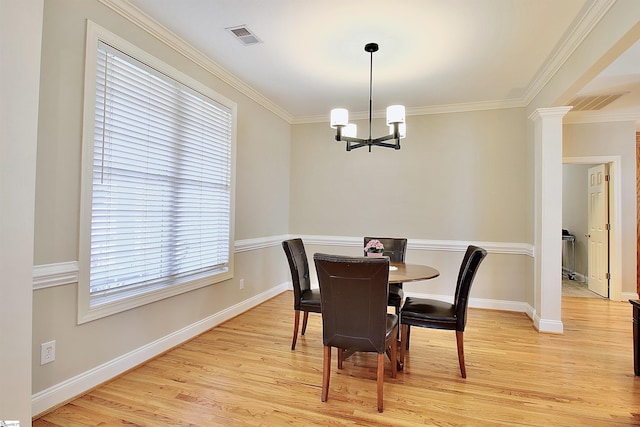 dining space with baseboards, visible vents, light wood finished floors, and a chandelier