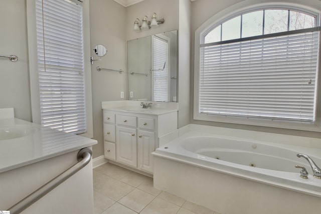 full bathroom with tile patterned flooring, vanity, and a whirlpool tub