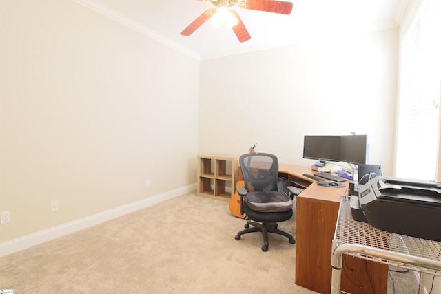 office featuring carpet flooring, baseboards, a ceiling fan, and crown molding