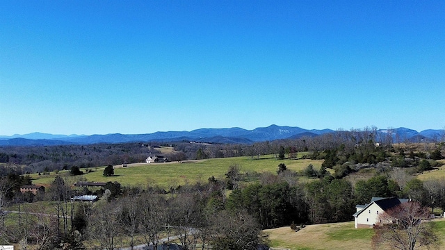 view of mountain feature with a rural view