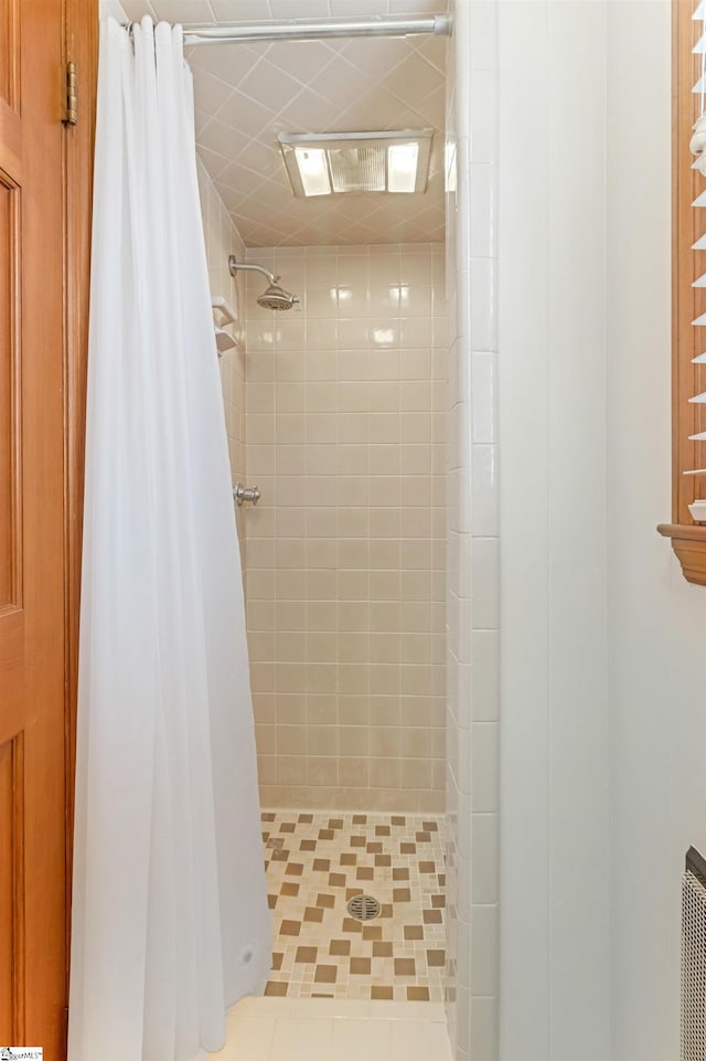 bathroom with a stall shower