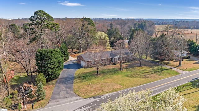 bird's eye view featuring a wooded view