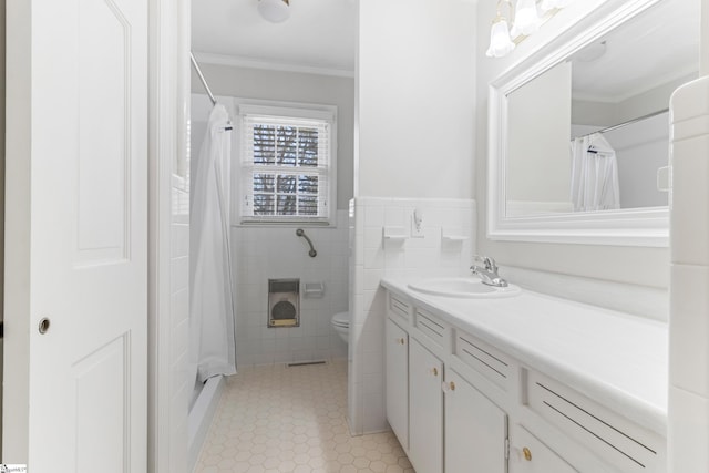 full bathroom with toilet, ornamental molding, tile walls, tile patterned flooring, and vanity