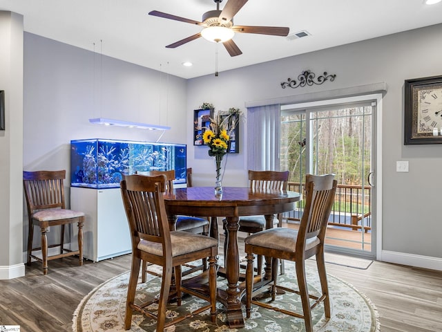 dining space featuring visible vents, a ceiling fan, wood finished floors, recessed lighting, and baseboards