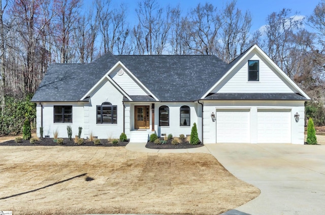 view of front of home with an attached garage, brick siding, driveway, and a shingled roof