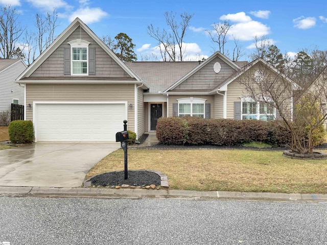 view of front of property featuring a front yard and driveway