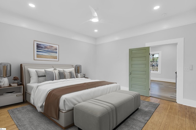 bedroom with a ceiling fan, light wood-style flooring, recessed lighting, and baseboards