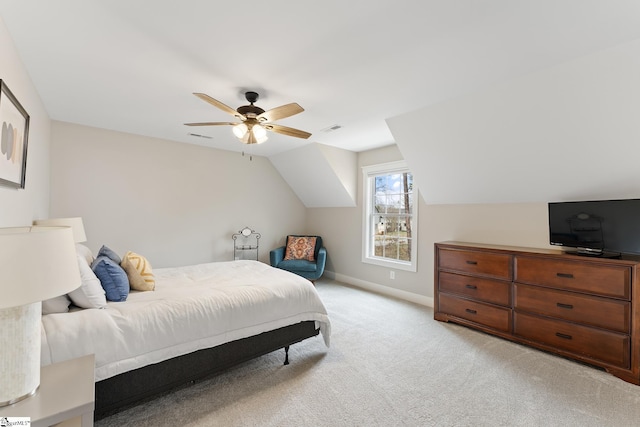 bedroom featuring visible vents, baseboards, vaulted ceiling, light carpet, and a ceiling fan