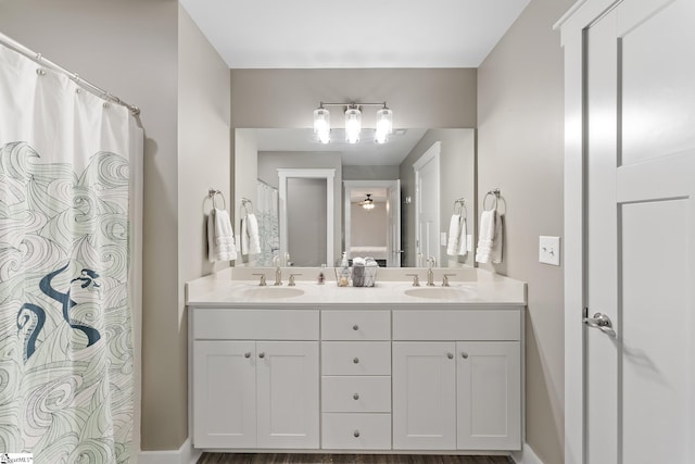 full bath with a sink and double vanity