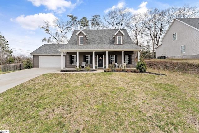 view of front facade with roof with shingles, covered porch, concrete driveway, a front lawn, and a garage