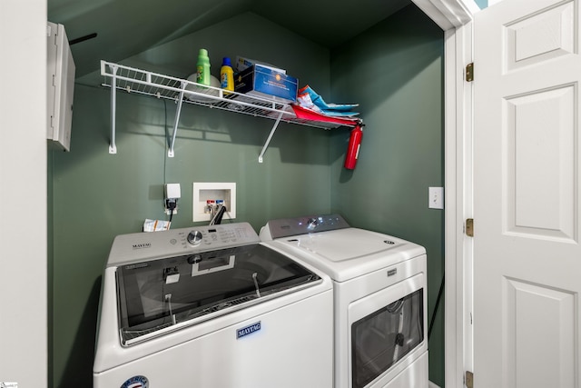 laundry area with washer and clothes dryer and laundry area