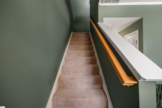 stairway with carpet flooring, visible vents, and baseboards