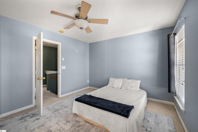 bedroom with baseboards, carpet, and ceiling fan