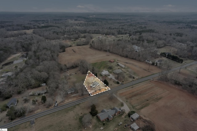 birds eye view of property featuring a rural view