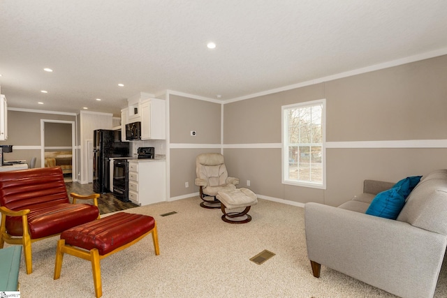 living area with visible vents, baseboards, recessed lighting, ornamental molding, and dark carpet