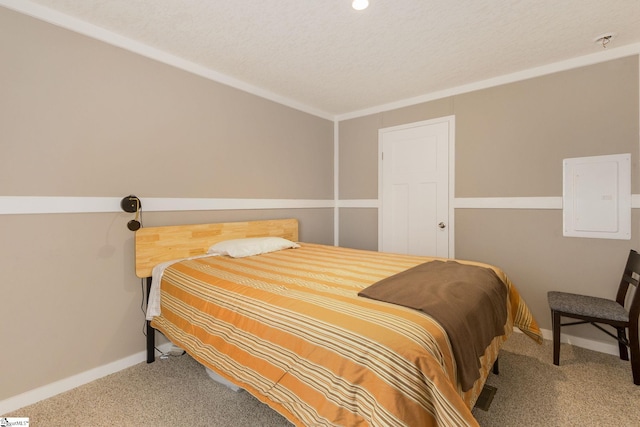 bedroom featuring baseboards, carpet, and a textured ceiling