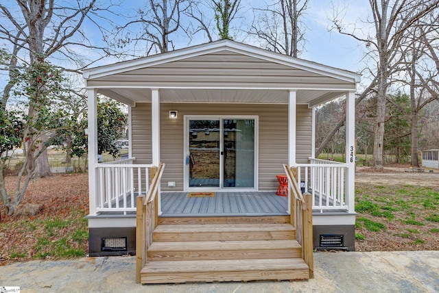 doorway to property featuring a porch